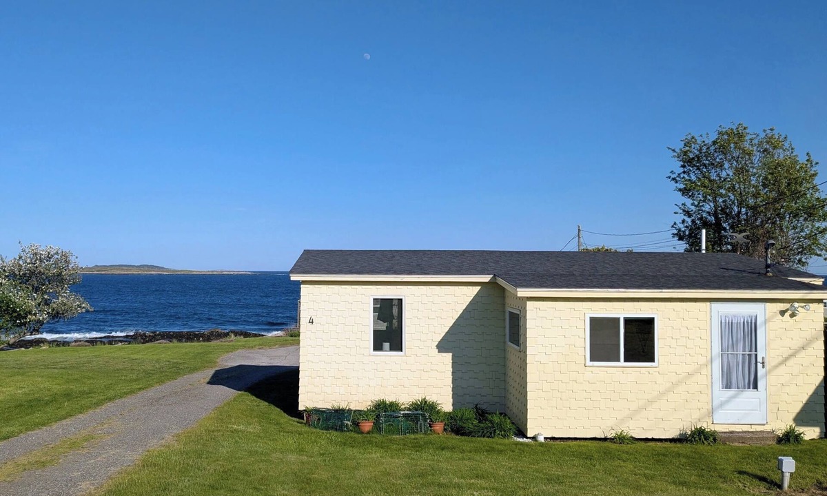Mid-Coast and Islands Cottage | The Yellow Cottage is a 2-bedroom little getaway located right on its own private beach.