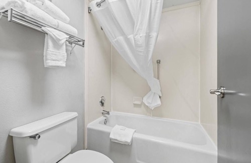 Orchard District Hotel | Relax and Recharge! 3 Comfortable Units! Enjoy Pool Access and Parking On-Site!