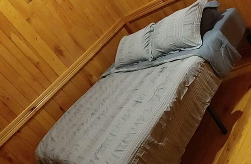 Gerry House | Woodys Retreat this rental includes the barn outdoor covered fire pit