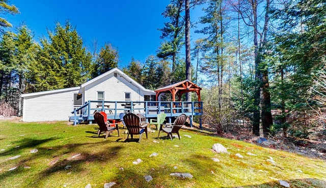 Tree-lined dog-friendly cottage with wrap-around deck, grill, & gas fireplace